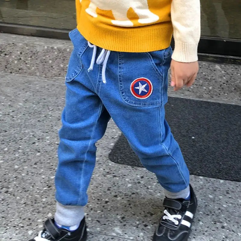 The new Marvel series of Spiderman Iron Man boys spring and autumn fashion cartoon anime pattern soft casual and versatile jeans